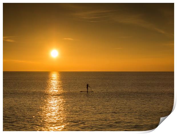 sunset paddle boarder at Westward Ho  Print by Tony Twyman