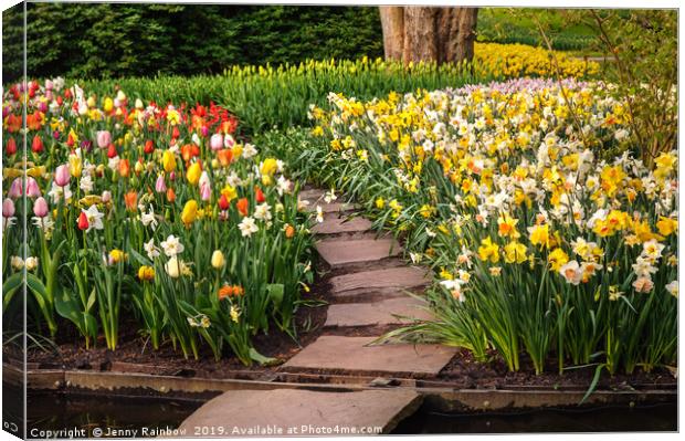 Colorful World of Keukenhof. Tiled Path through Fl Canvas Print by Jenny Rainbow