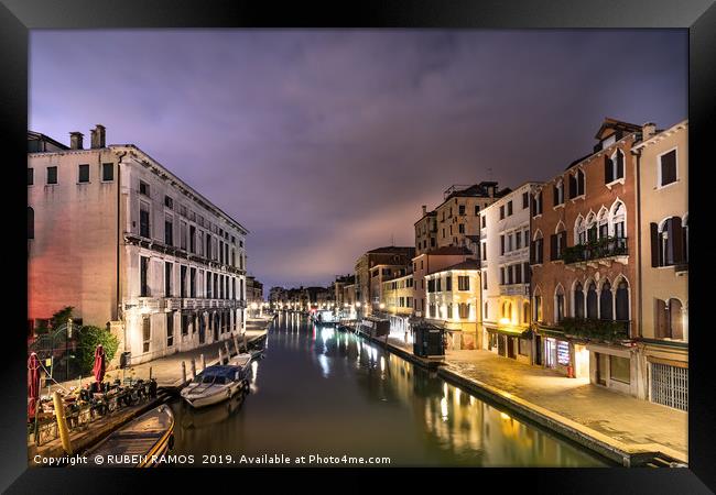 A canal water street with boats in Venice. Framed Print by RUBEN RAMOS