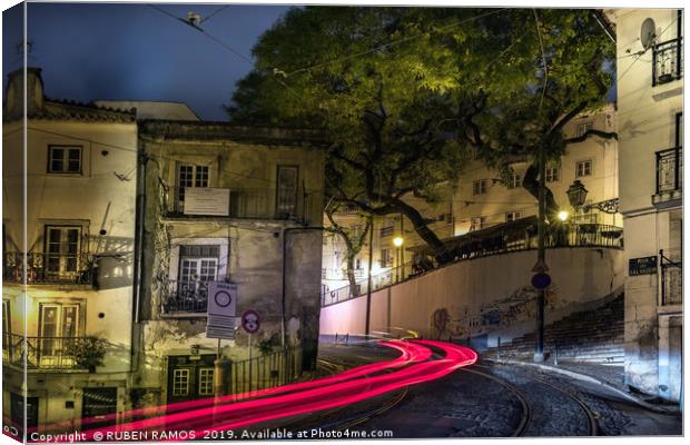 The Rua do Salvador street and light tails at nigh Canvas Print by RUBEN RAMOS