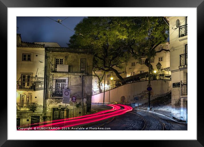 The Rua do Salvador street and light tails at nigh Framed Mounted Print by RUBEN RAMOS