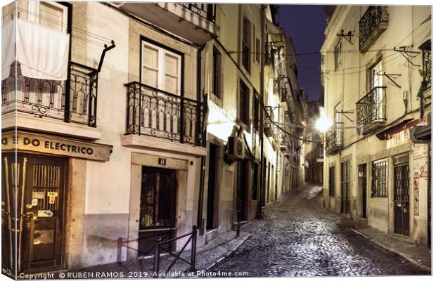 A narrow stone street empty in Lisbon. Canvas Print by RUBEN RAMOS