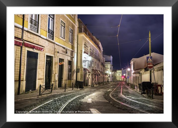 An old stone street in Lisbon at night. Framed Mounted Print by RUBEN RAMOS