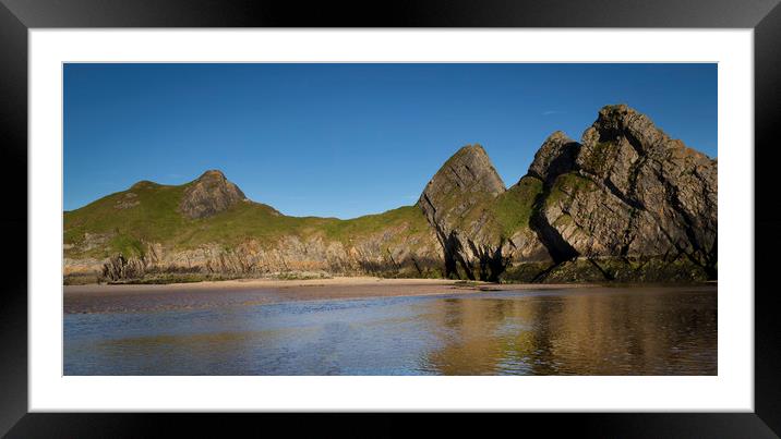 The rugged Three Cliffs Bay Framed Mounted Print by Leighton Collins