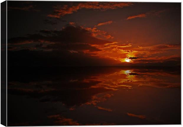 Sunset over water Canvas Print by Richie Fairlamb