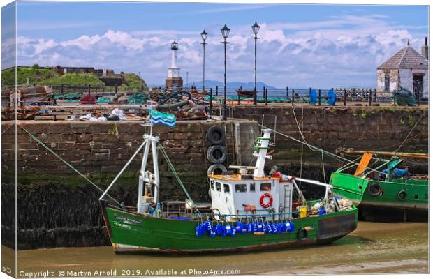 Maryport Harbour and lighthouse Canvas Print by Martyn Arnold
