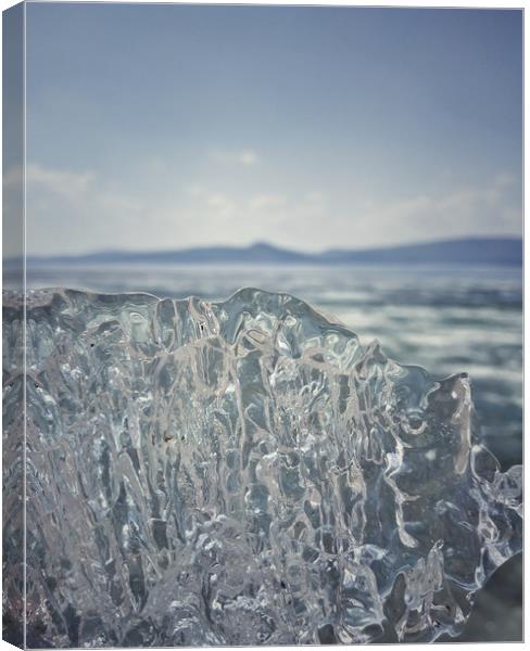 A piece of crystal transparent ice in the hand aga Canvas Print by Larisa Siverina