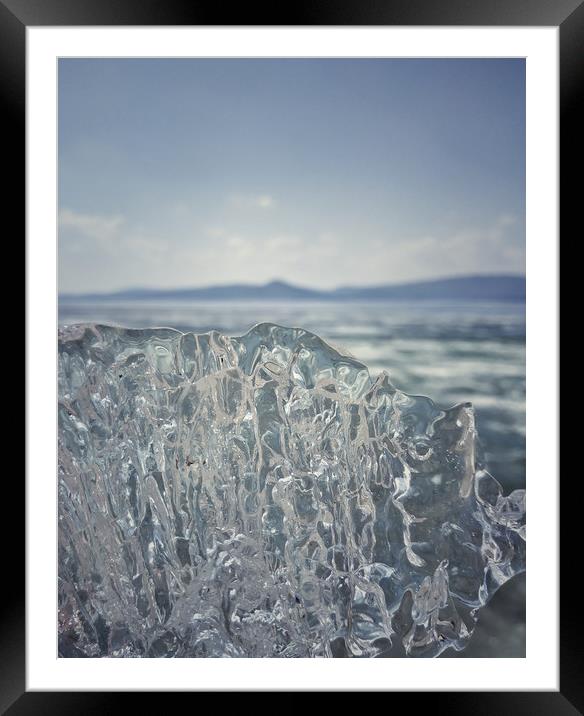 A piece of crystal transparent ice in the hand aga Framed Mounted Print by Larisa Siverina