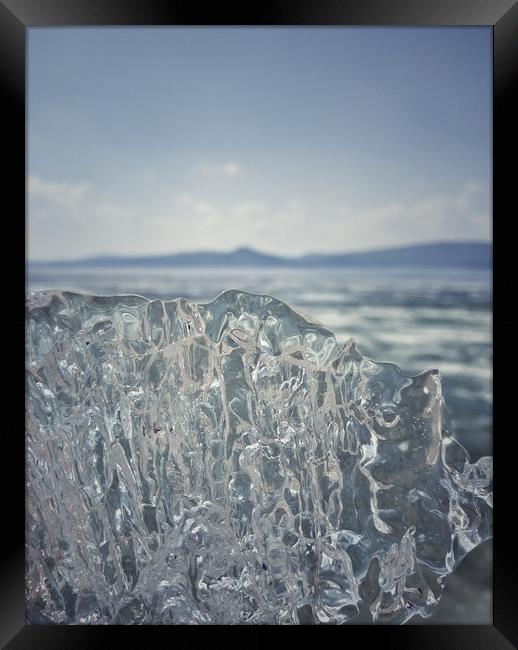 A piece of crystal transparent ice in the hand aga Framed Print by Larisa Siverina