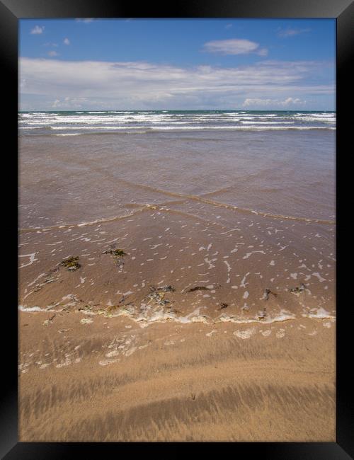 Westward Ho beach with waves approaching the shor Framed Print by Tony Twyman