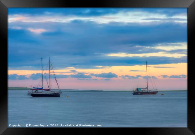Boats at sunset on the Swale Estuary in Kent  Framed Print by Donna Joyce