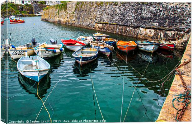 Rowing boats In Mevagissey Outer Harbour Canvas Print by James Lavott