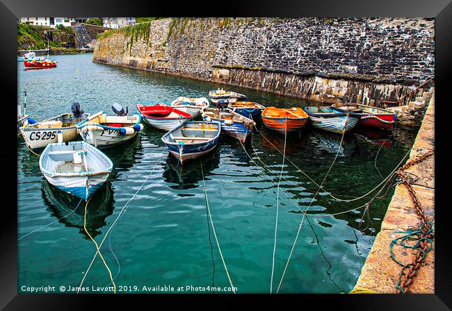 Rowing boats In Mevagissey Outer Harbour Framed Print by James Lavott