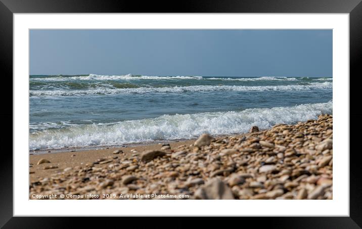 ocean waves and rocks on the beach Framed Mounted Print by Chris Willemsen