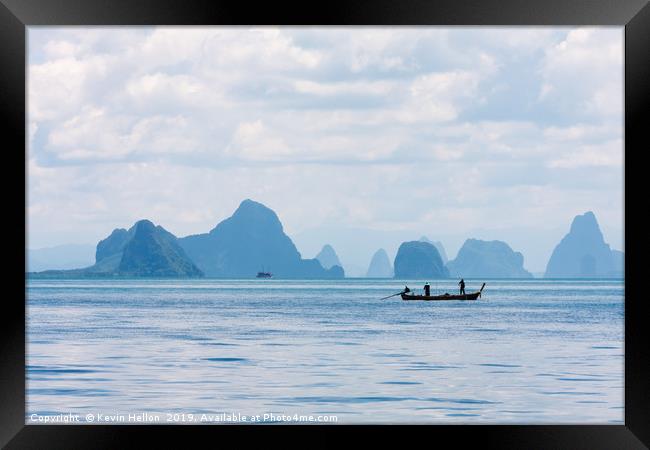 Two men in a boat fishing Framed Print by Kevin Hellon