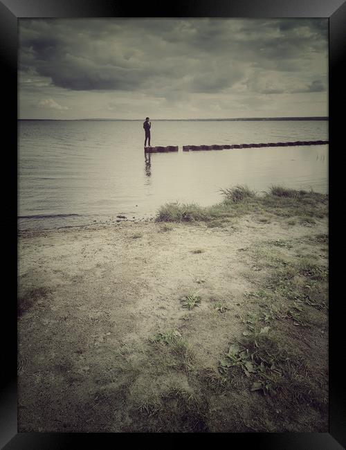 Lonely man walking on a lake Framed Print by Larisa Siverina