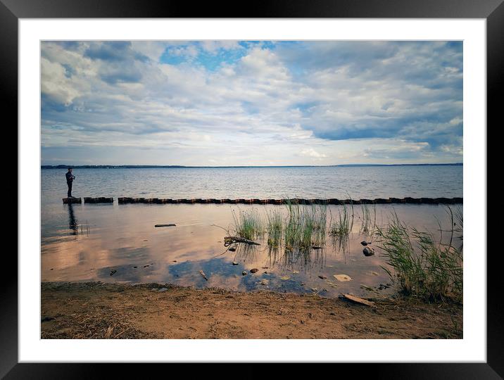 Lonely man walking on a beach. Framed Mounted Print by Larisa Siverina