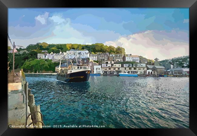 A fishing boat returns to Looe in Cornwall Framed Print by Rosie Spooner