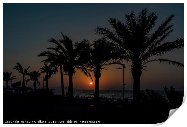Sun setting in Crete Print by Kevin Clelland