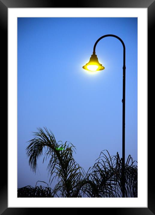 This is a street light at dusk. This is s popular  Framed Mounted Print by Jose Manuel Espigares Garc