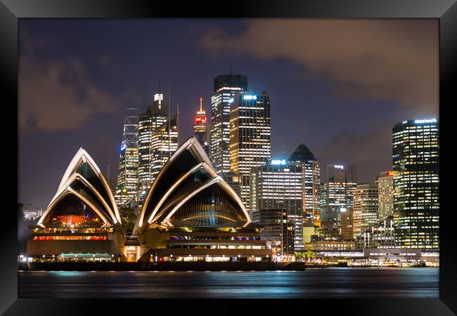 Sydney Opera House and skyline after dark.  Framed Print by Andrew Michael