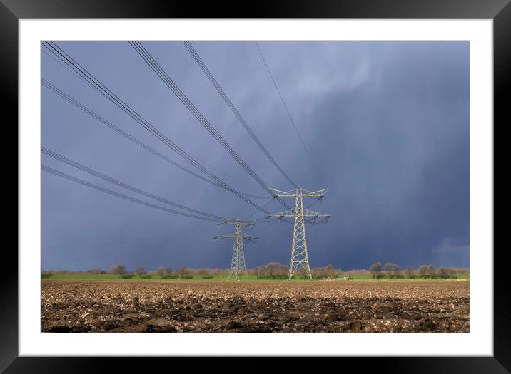 Power pylon in bad weather Framed Mounted Print by John Stuij