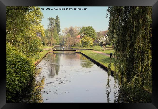 Crossing The Canal Bridge Framed Print by Jukka Heinovirta