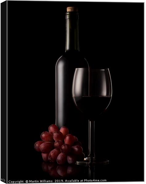Wine bottle, glass and grapes Canvas Print by Martin Williams