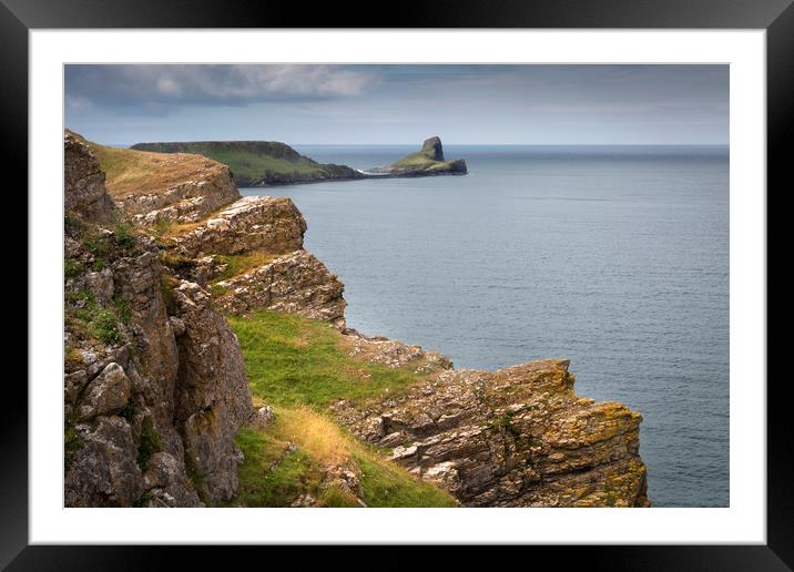 The jagged cliffs of Worms Head Framed Mounted Print by Leighton Collins