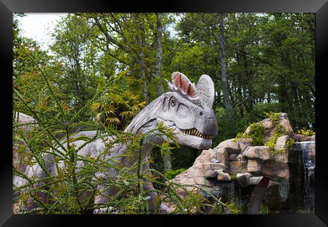 Dinosaur creates an ambush Framed Print by Clive Wells