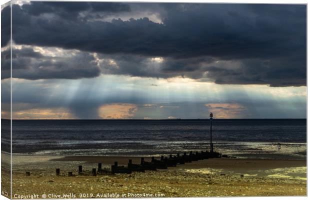 Dark skies over the Wash at Hunstanton Canvas Print by Clive Wells