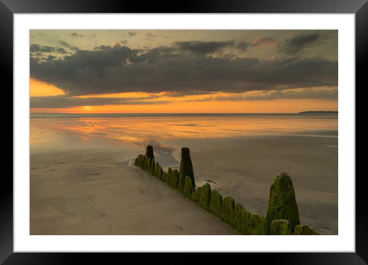 Westward Ho! sunset with weathered beach groynes Framed Mounted Print by Tony Twyman