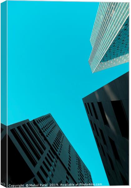 Tall skyscrapers against clear turquoise sky  Canvas Print by Mehul Patel