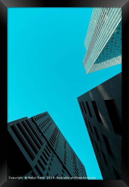 Tall skyscrapers against clear turquoise sky  Framed Print by Mehul Patel