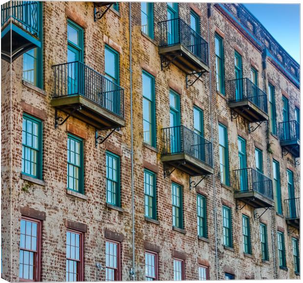Old Brick Building with Red and Green Windows and Balconies Canvas Print by Darryl Brooks