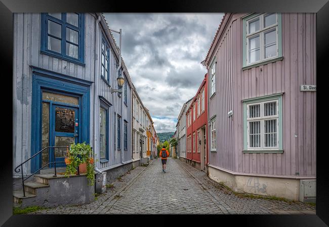Trondheim Narrow Street with Backpacker Framed Print by Antony McAulay