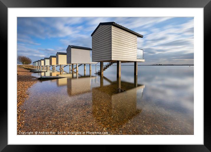 Reflections at Osea Beach Huts. Framed Mounted Print by Andrew Ray