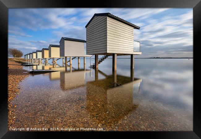 Reflections at Osea Beach Huts. Framed Print by Andrew Ray
