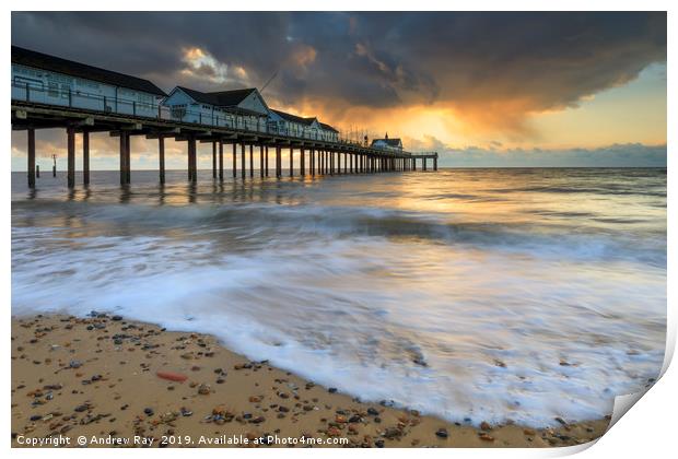 Stormy clouds at sunrise (Southwold Pier) Print by Andrew Ray