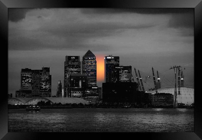 Sunset over Canary Wharf London  Framed Print by sylvia scotting