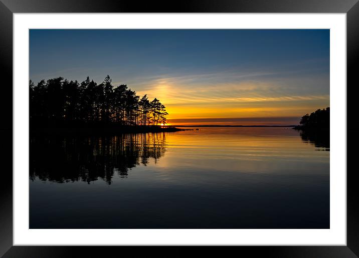 orange sunset over a calm lake in Sweden Framed Mounted Print by Jonas Rönnbro