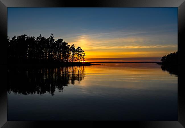 orange sunset over a calm lake in Sweden Framed Print by Jonas Rönnbro
