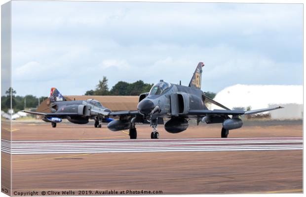 Both F-4E phantoms about to depart RAF Fairford Canvas Print by Clive Wells