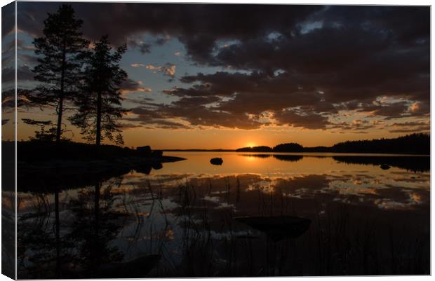 sunset over lake Canvas Print by Jonas Rönnbro