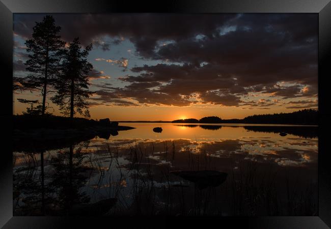 sunset over lake Framed Print by Jonas Rönnbro