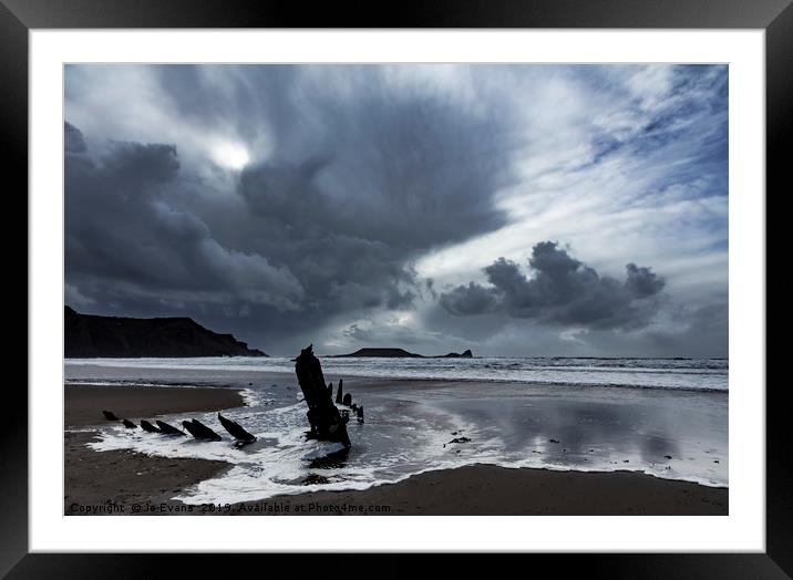 Storm Clouds over the Wreck of the Helvetia Framed Mounted Print by Jo Evans