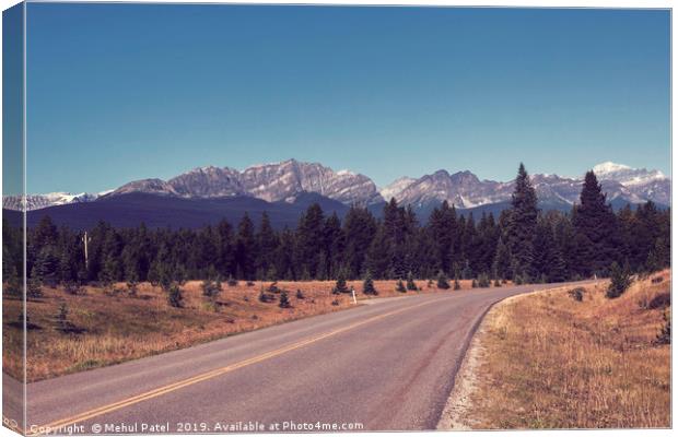 Roadside view - Rocky Mountains Canvas Print by Mehul Patel