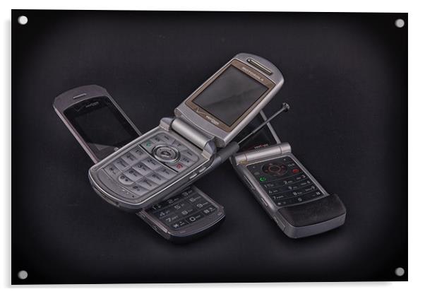 Three Flip Phones on Black Acrylic by Darryl Brooks