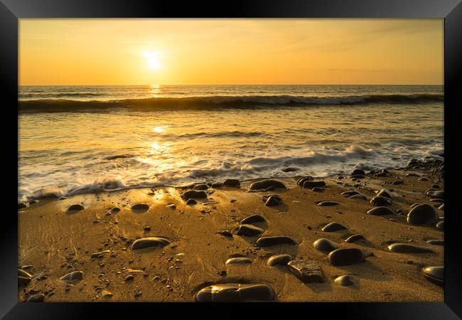 Sunlit pebbles on Westward Ho! beach at Sunset Framed Print by Tony Twyman