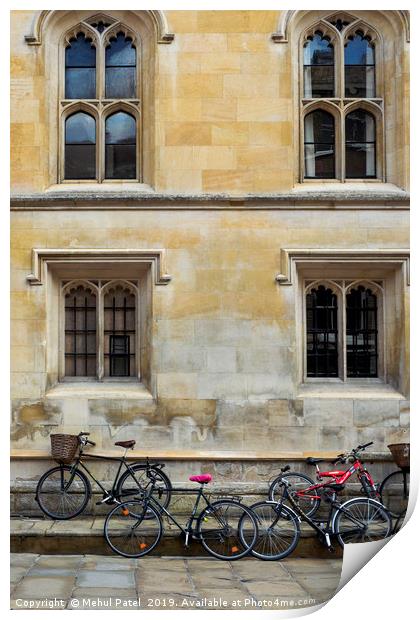 Bicycles parked along the pavement in Cambridge Print by Mehul Patel